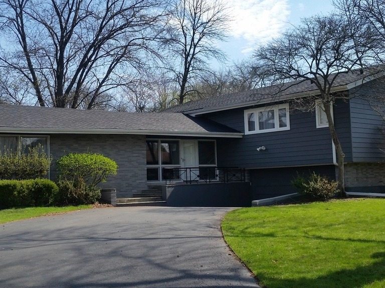 Sample photo: home with a dark asphalt shingle roof